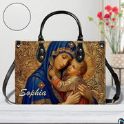Madonna and Child handbag displayed with circular surface texture zoom detail inset