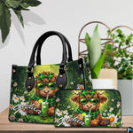 Tabletop presentation displaying the green plaid calf and daisy artwork alongside potted plants.