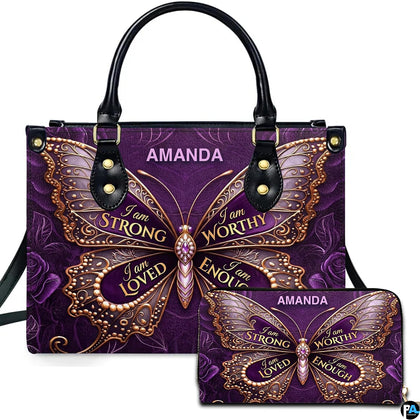 Purple butterfly affirmation handbag and matching wallet shown together.