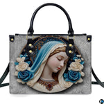 Front view of Virgin Mary cerulean veil cameo bas-relief handbag on white background