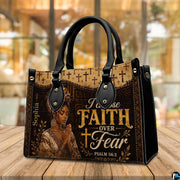 Handbag on wooden table with blurred cafe background