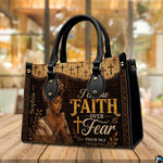 Handbag on wooden table with blurred cafe background