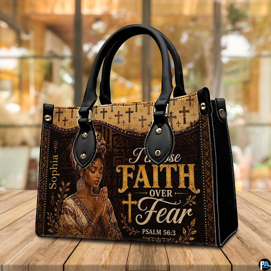 Handbag on wooden table with blurred cafe background