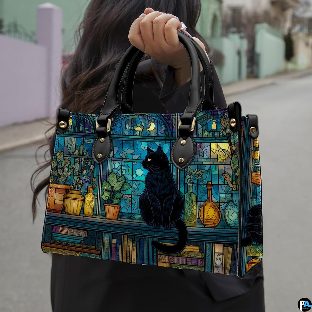 Model walking outdoors holding the nocturnal cat on crescent moon stained glass printed creation.