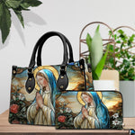 Matching handbag and zippered wallet set displayed together with stained glass art.
