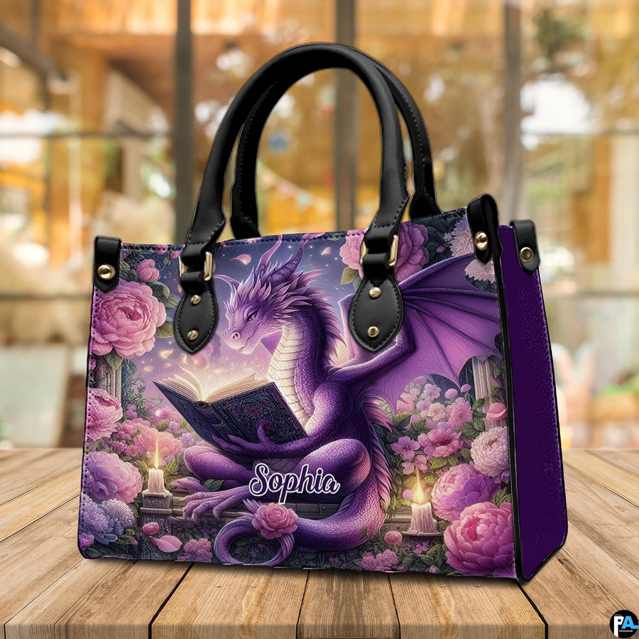 Purple dragon handbag resting on wooden cafe table under warm ambient light.