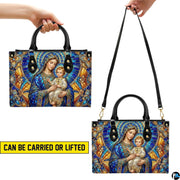 Back view of stained glass Madonna handbag showing coordinated cathedral mosaic pattern