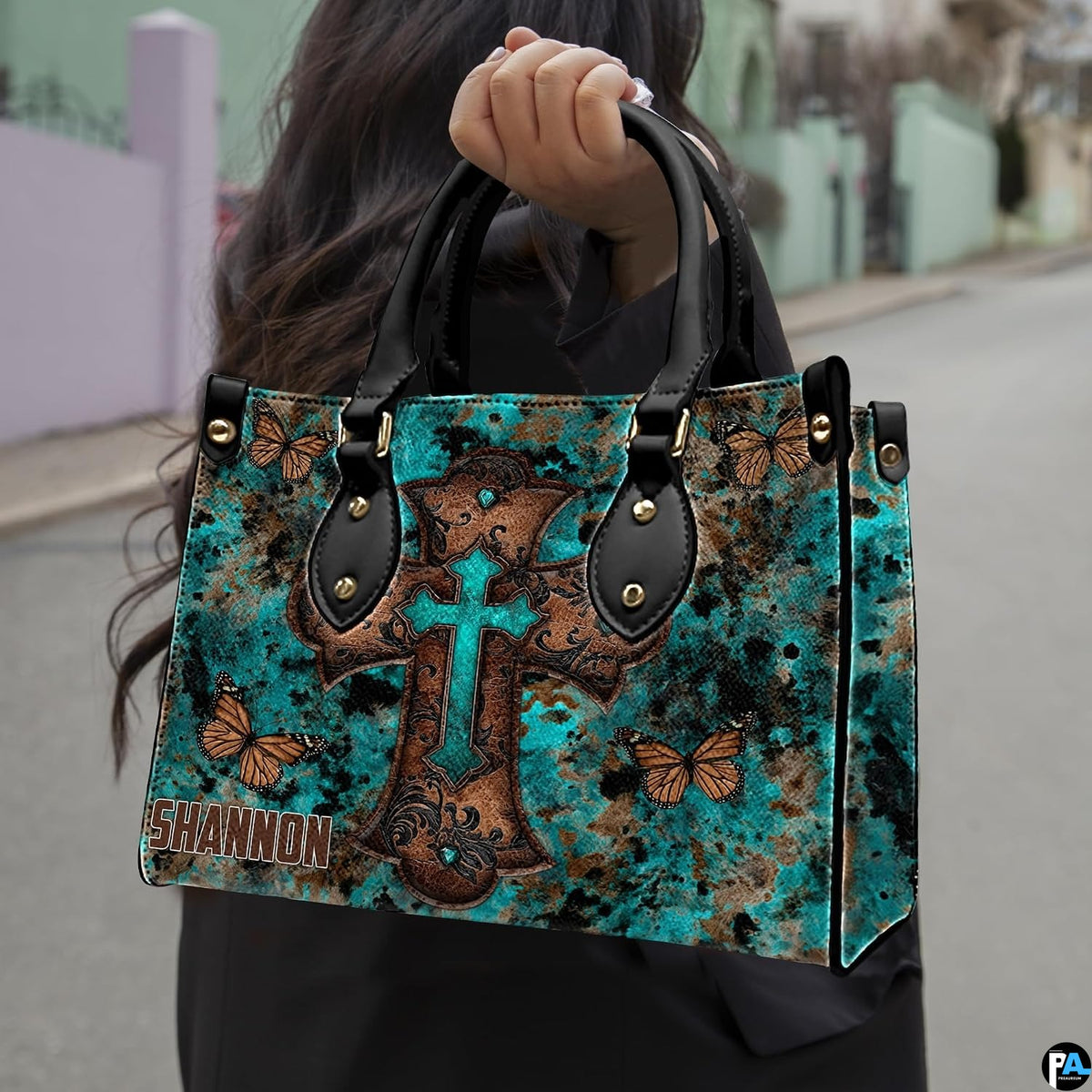 Rustic turquoise cross butterfly handbag paired with matching wallet in western patina theme.