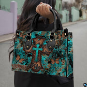 Rustic turquoise cross butterfly handbag paired with matching wallet in western patina theme.
