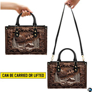 Carved Santa sleigh handbag carrying demonstration showing top handle and shoulder strap carry.