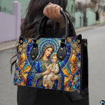 Lifestyle display of stained glass Madonna handbag carried by model showing mosaic scale
