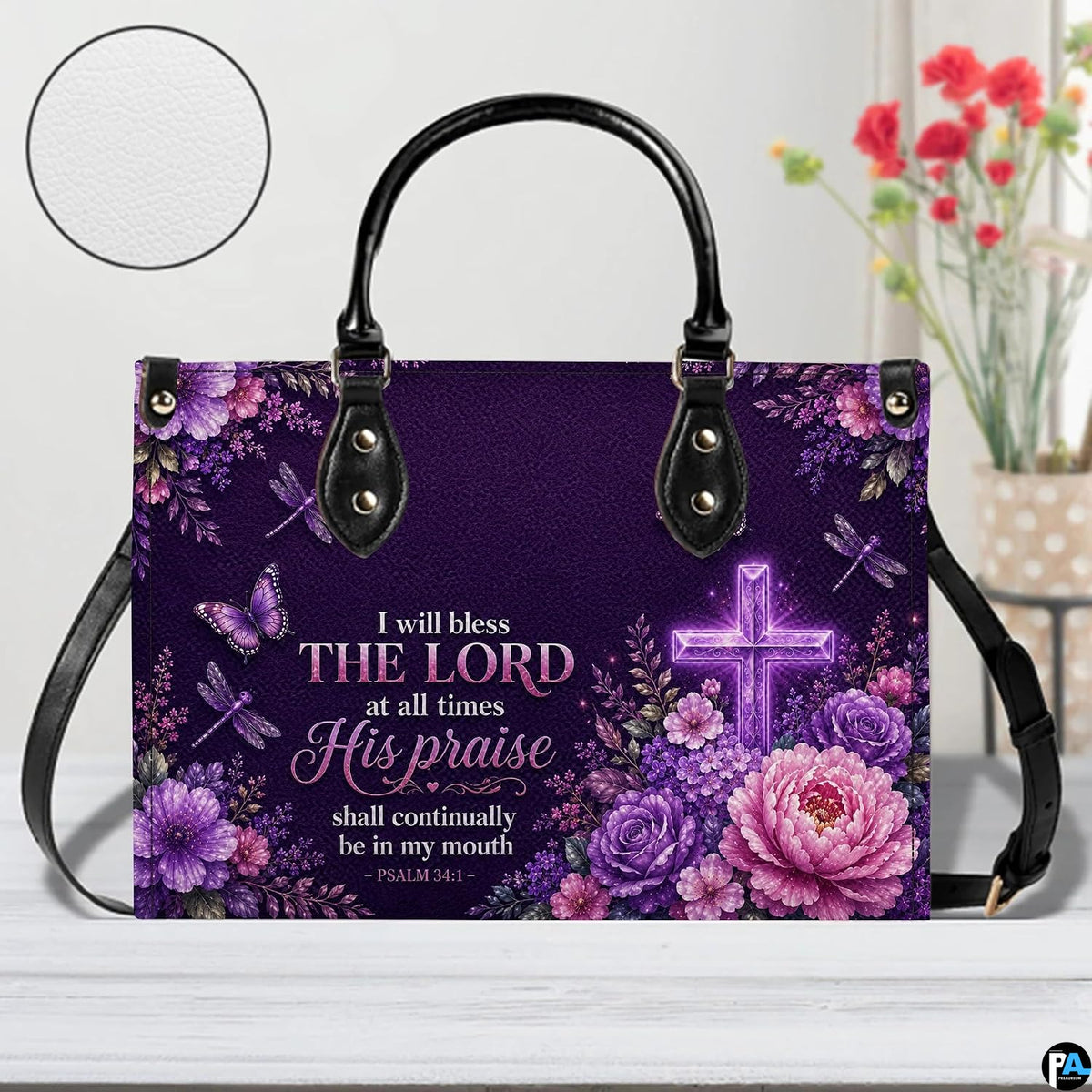Top angle view showing black carrying handles and main zippered opening of purple cross purse.
