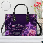 Top angle view showing black carrying handles and main zippered opening of purple cross purse.