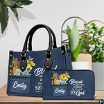Angled display showing scripture denim handbag beside matching personal organizer