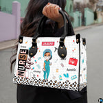 Chibi scrub cap nurse handbag carried outdoors showing visual scale against street backdrop.