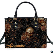 Gothic golden skull rose spiderweb handbag displayed alone on white studio background.