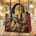 Crowned Madonna handbag displayed alongside matching continental wallet