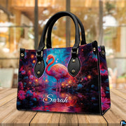 Side profile perspective of the handbag showing structured dark side panel and hardware.