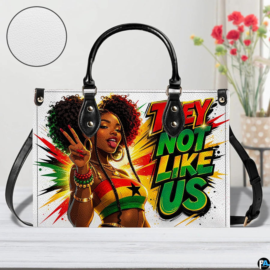 Front view of Afrocentric handbag with peace-sign portrait and long strap