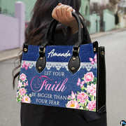 Model outdoors carrying denim and lace floral peony handbag