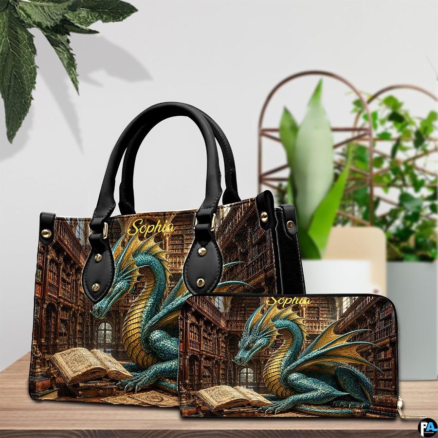 Three-quarter view of library dragon purse showing structured silhouette, handles, and gold accents
