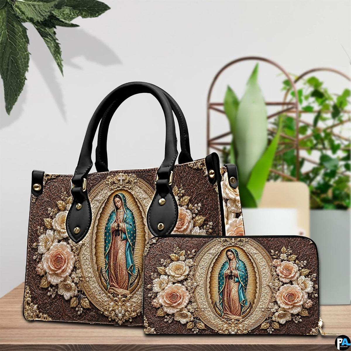 Matching Our Lady of Guadalupe handbag and wallet set in botanical lifestyle display