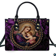 Front view of royal purple handbag displaying circular pearl cameo of Virgin Mary cradling infant Jesus.