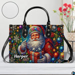 Festive vintage Santa handbag on light tabletop beside flowers in vase.