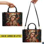 Carrying options for terracotta mosaic Praying Virgin Mary handbag with handles and shoulder strap.