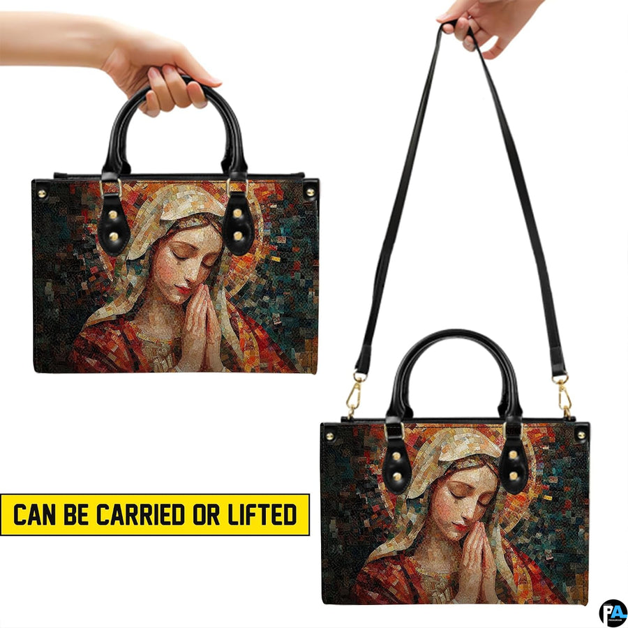 Carrying options for terracotta mosaic Praying Virgin Mary handbag with handles and shoulder strap.