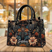 Three-quarter angle view of gothic peacock moth handbag set