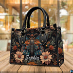 Three-quarter angle view of gothic peacock moth handbag set