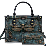 Embossed bronze dragonfly and baroque frame handbag and wallet set displayed together on white background