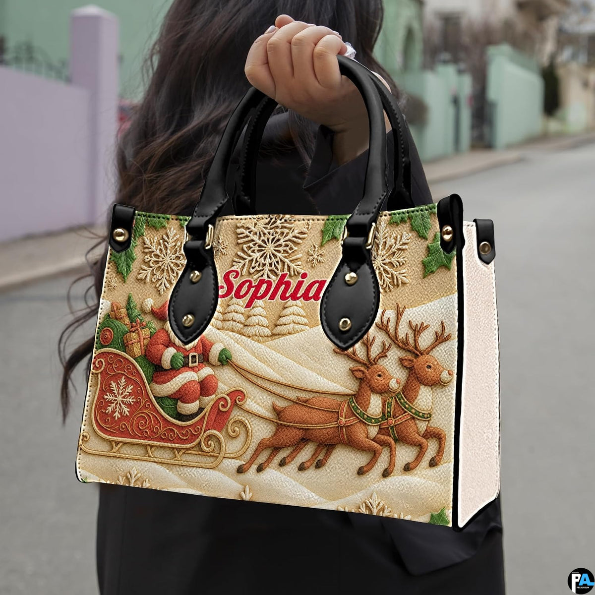 Lifestyle view of model carrying carved Santa sleigh handbag by top handles on street