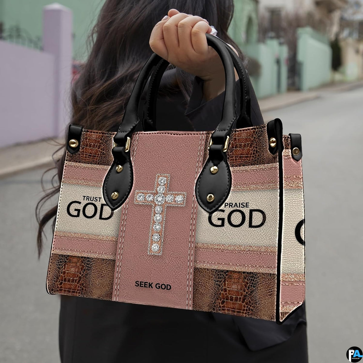 Pairing of faith crystal cross handbag and wallet displaying coordinated spiritual motifs.
