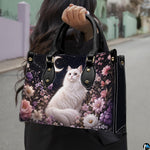 Outdoor view showcasing celestial white cat artwork held alongside an urban walkway.