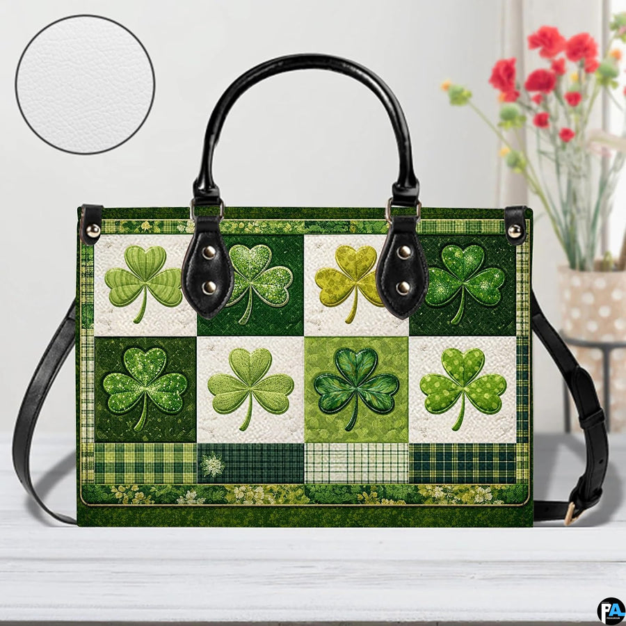 Front view of green clover handbag with mixed patterned panels and plaid accents
