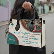 Outdoor lifestyle presentation of scripture verse handbag carried over the shoulder.