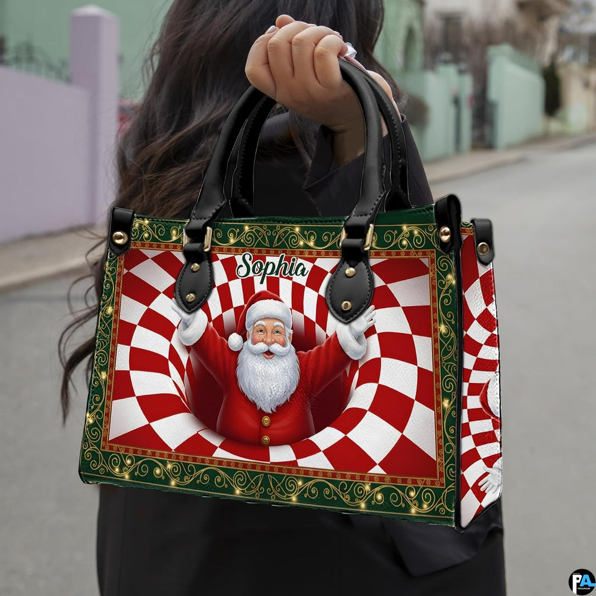 Woman holding holiday handbag outdoors showing Santa Claus optical illusion artwork in daylight.