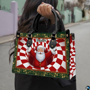 Woman holding holiday handbag outdoors showing Santa Claus optical illusion artwork in daylight.