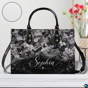 Gothic raven skull rose briar handbag displayed alone on white background.