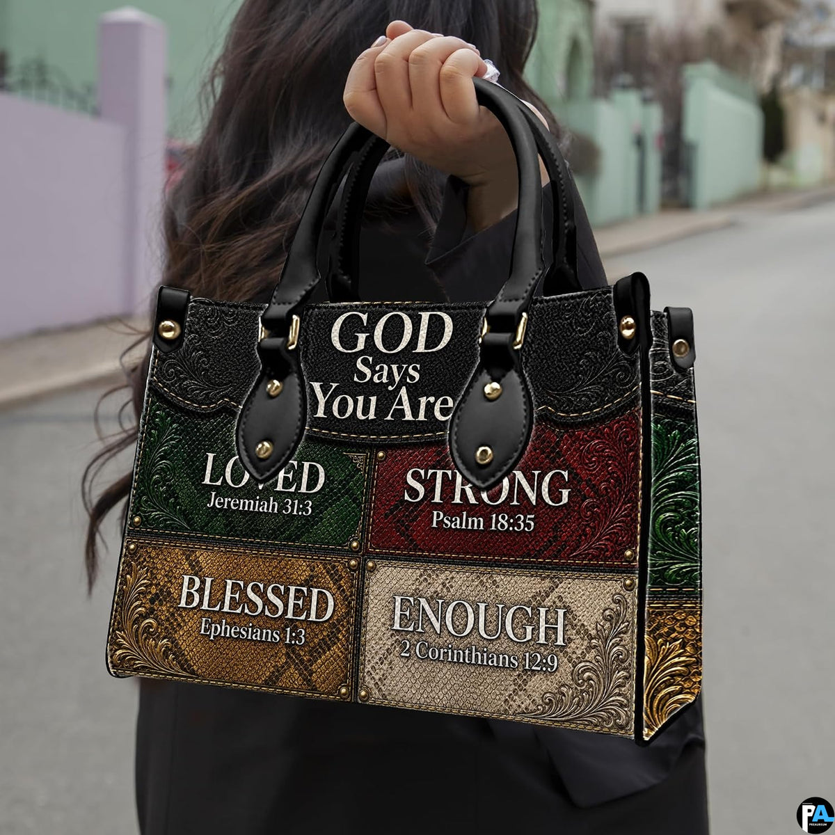 Detailed angle view of textured green and red patchwork panels with ornate floral corner tooling on handbag.