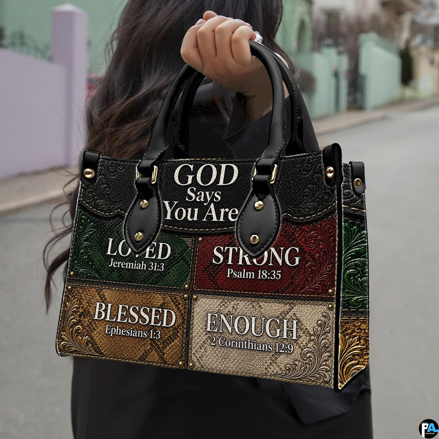 Detailed angle view of textured green and red patchwork panels with ornate floral corner tooling on handbag.