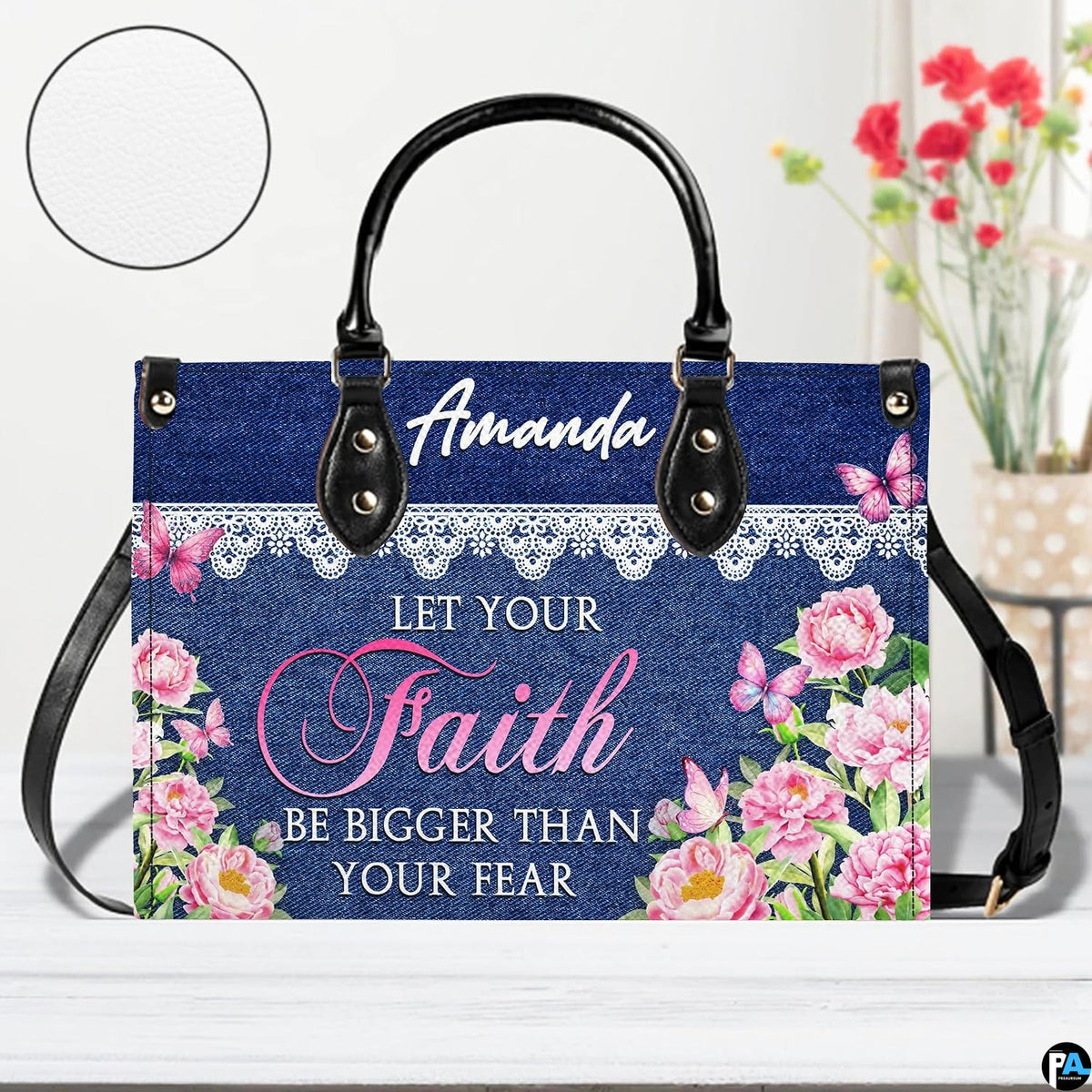 Back view of structured denim and lace patterned handbag