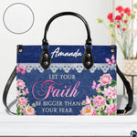 Back view of structured denim and lace patterned handbag