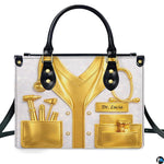 Doctor coat uniform with gold stethoscope and diagnostic tools on white structured handbag.
