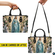 Side profile view of structured rosary handbag showing silhouette and black carry handles