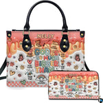 Front view of pastel doodle faith handbag and matching zip wallet on solid white background