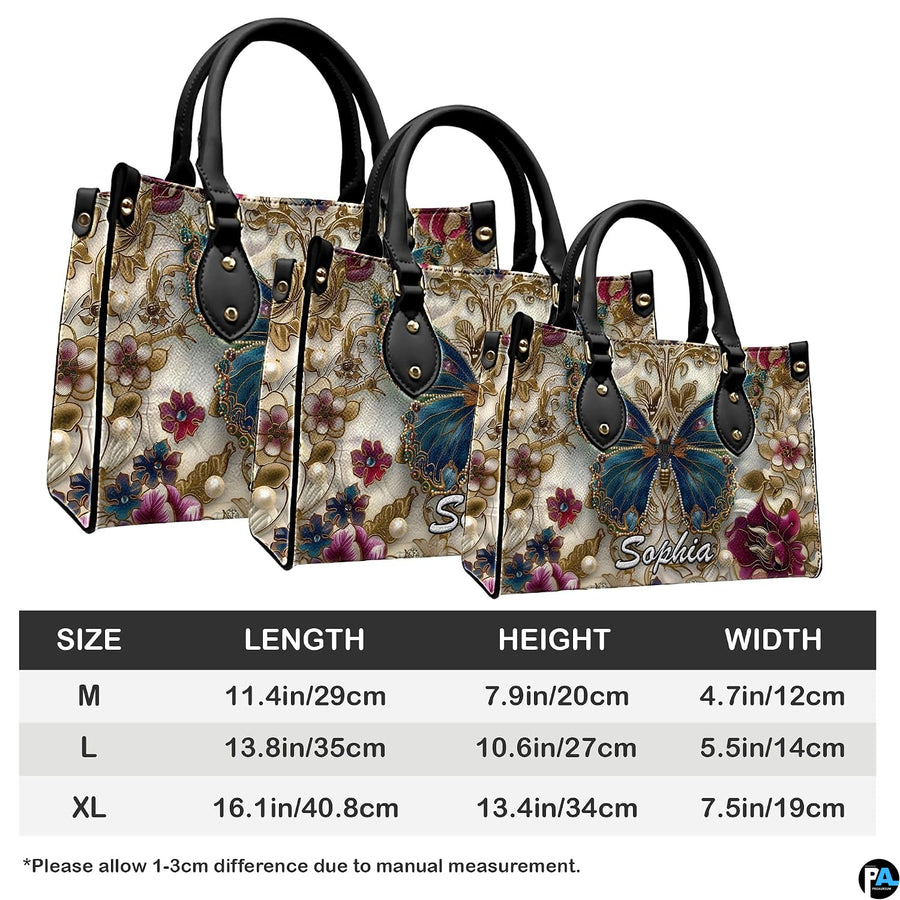 Side perspective view of baroque gold butterfly handbag and wallet pair