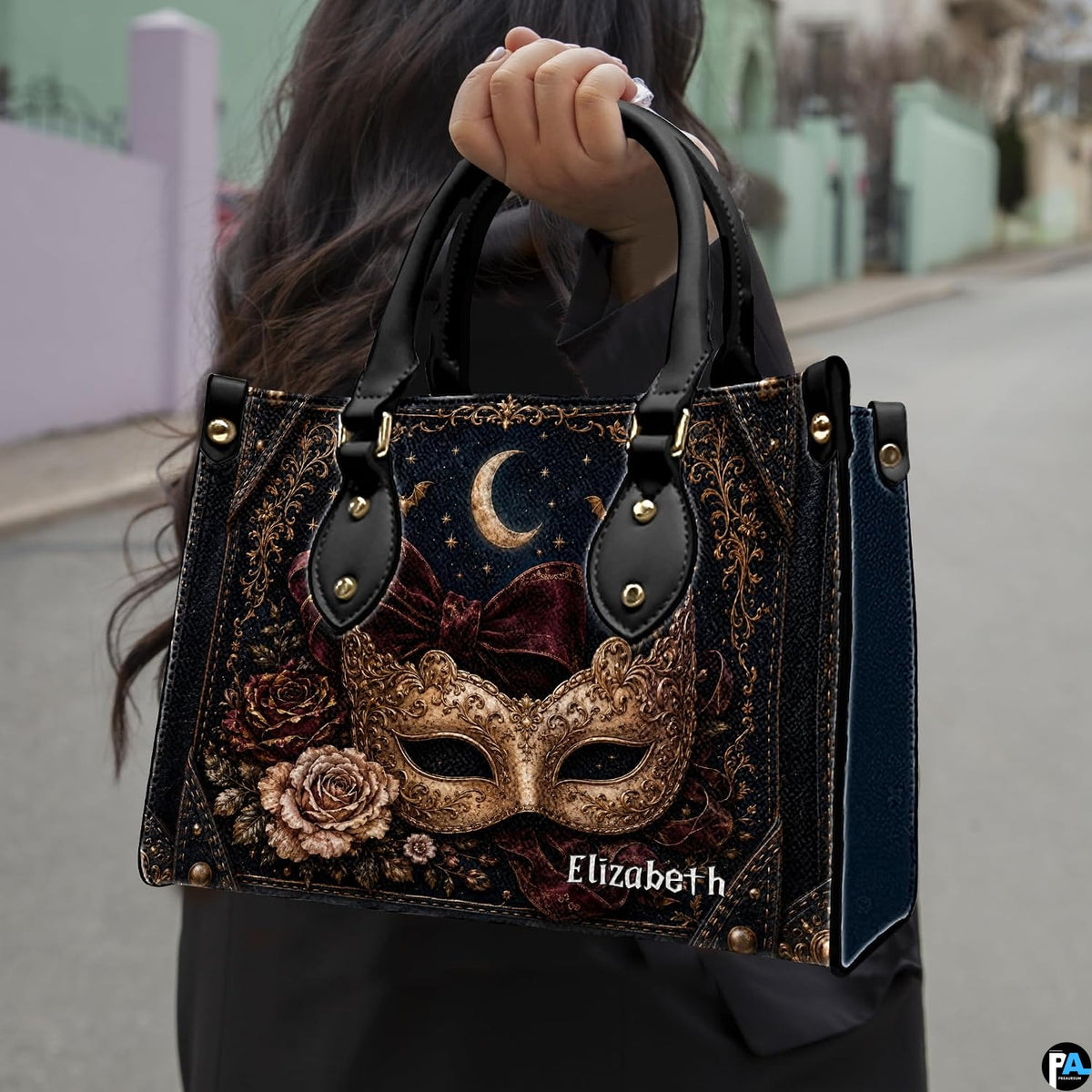 Frontal presentation highlighting the masquerade mask art design on the primary accessory silhouette.